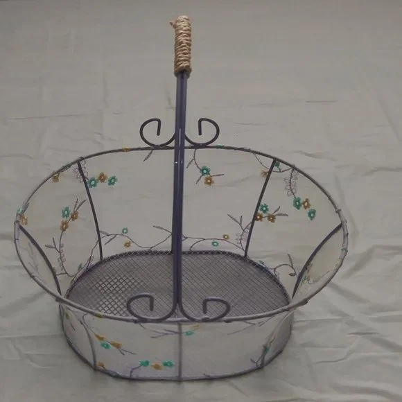 Metallic oval baskets, lined with veil and flower design.