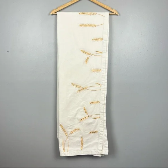 Pottery Barn 100% cotton ivory with embroidered wheat tablecloth, 67” x 100”.