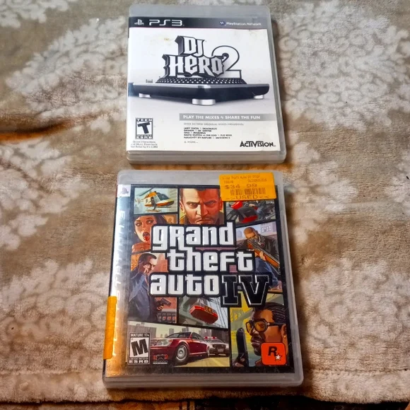 Lot 33- 2 PS3 GAME LOT Includes - Dj hero 2, and Grand theft auto IV PS3 GAMES