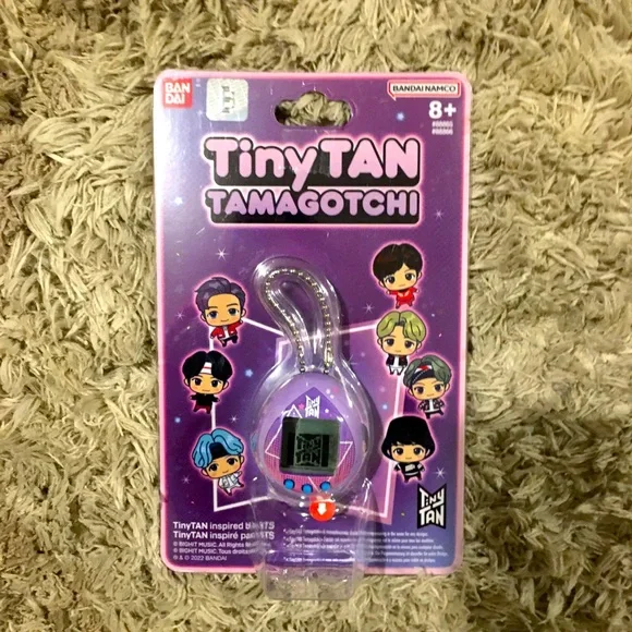 Purple Ban Dai Tiny Tan Tamagotchi.