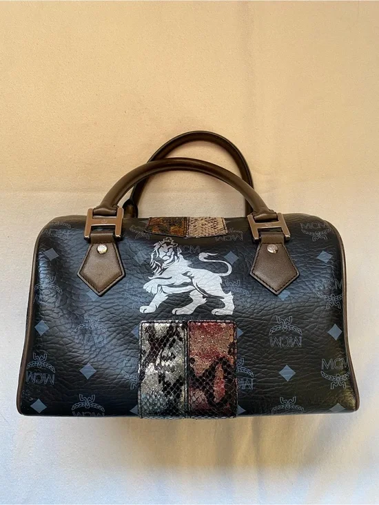 MCM Black Leather Boston Bag with Lion Motif and Mixed Snake-Print Accents