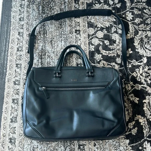Tumi genuine leather black briefcase with removable strap and silver hardware