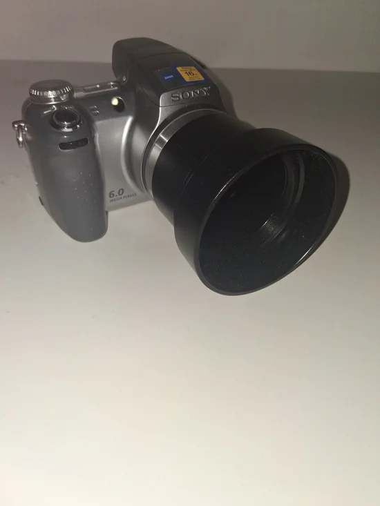 Sony Silver Digital Camera with Black Telephoto Lens