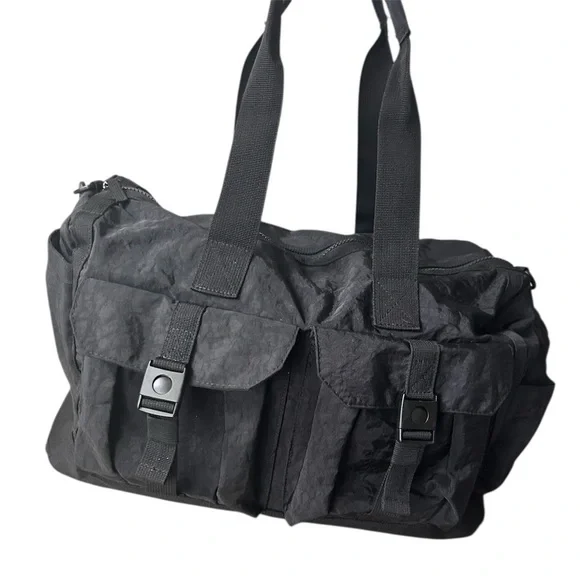 Tommy Bahama black travel duffle bag with hand and shoulder straps