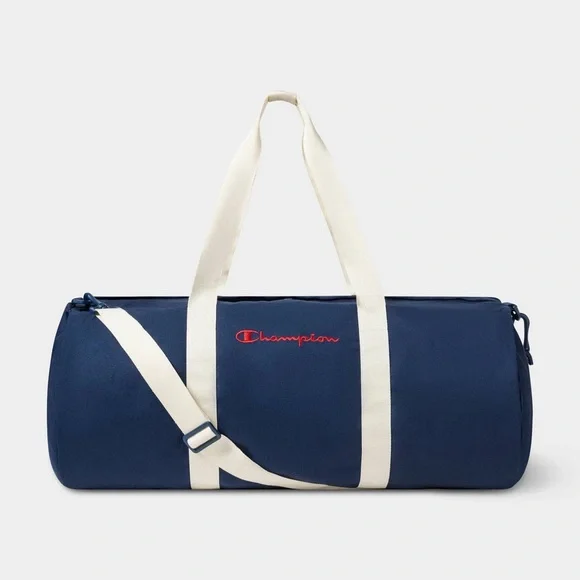 Champion duffel bag in navy blue with white straps and a red embroidered logo