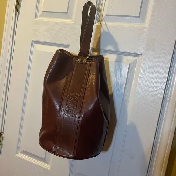 Fortune Duck vintage leather Brown sling back bucket style bag.