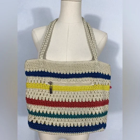 The Sak crocheted striped shoulder bag with pink pom-poms Casual Classics