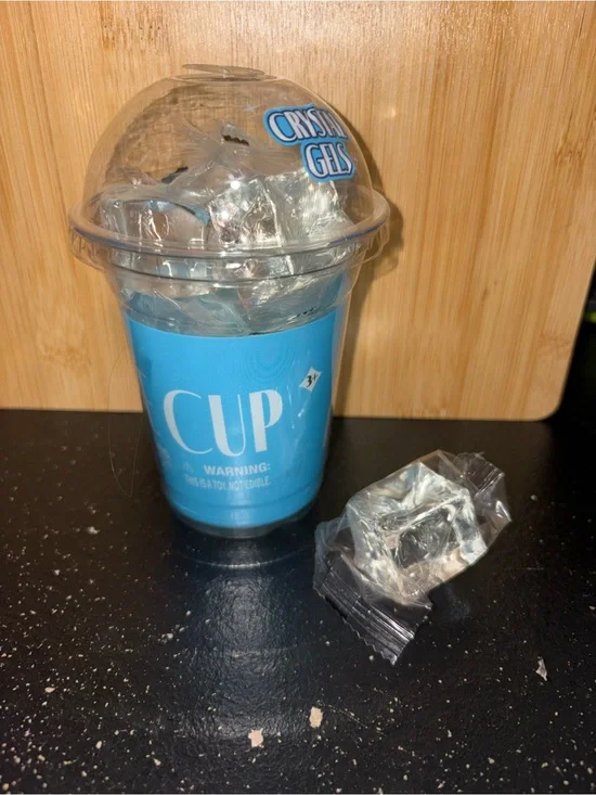 Cup of Clear Gel Ice squishy cubes.