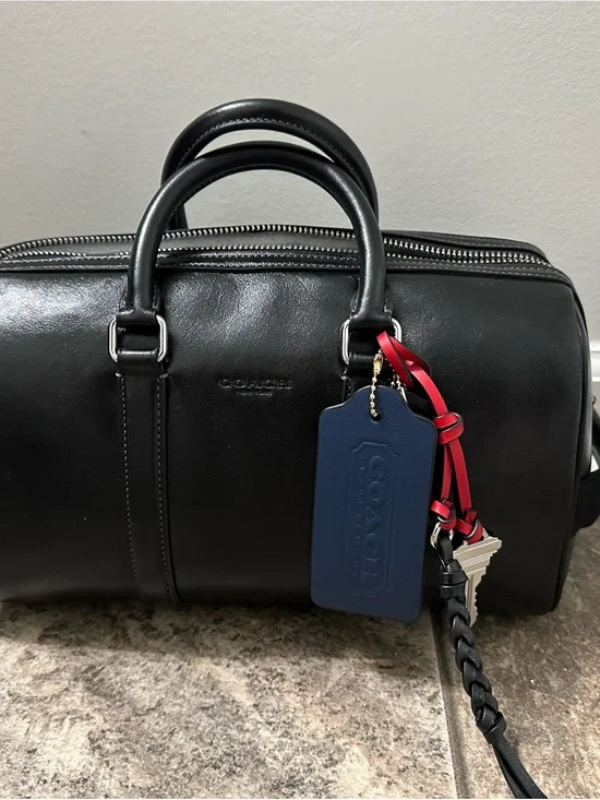 NWT Coach Venturer Black Duffel Bag 27 with bag charms