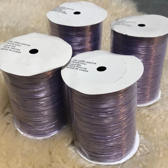 4 100 yard spools of lavender raffia