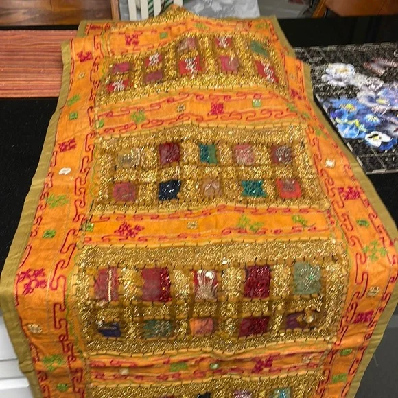 Table runner. 58 in length. Width 22 inches