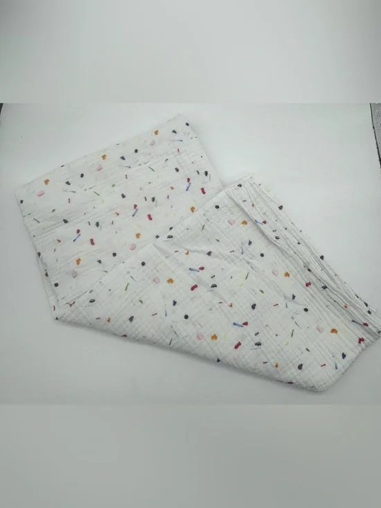 Lovevery Muslin Swaddle Blanket featuring Confetti Style Print