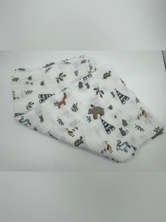 Little Unicorn Muslin Swaddle Blanket featuring Forest Friends Print