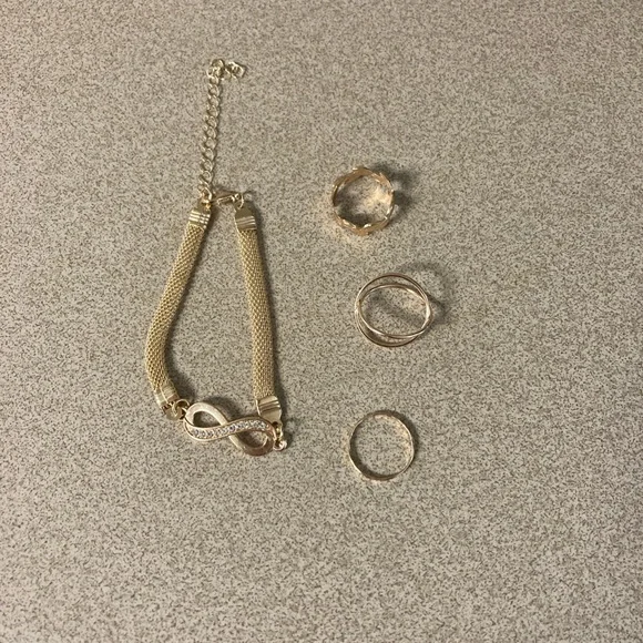 4/$20 bundle and save Gold Infinite Loop Bracelet with Crystal Accents - 3 rings