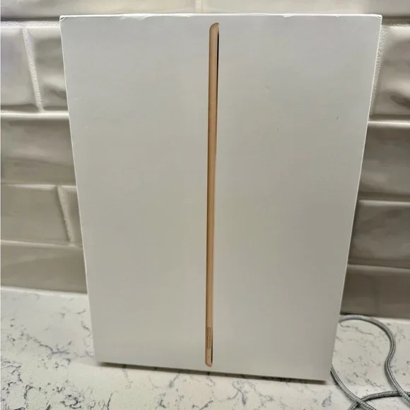 Apple 12.9” iPad Pro 128 GB (2nd Generation) Tablet in Gold comes with 2 cases.