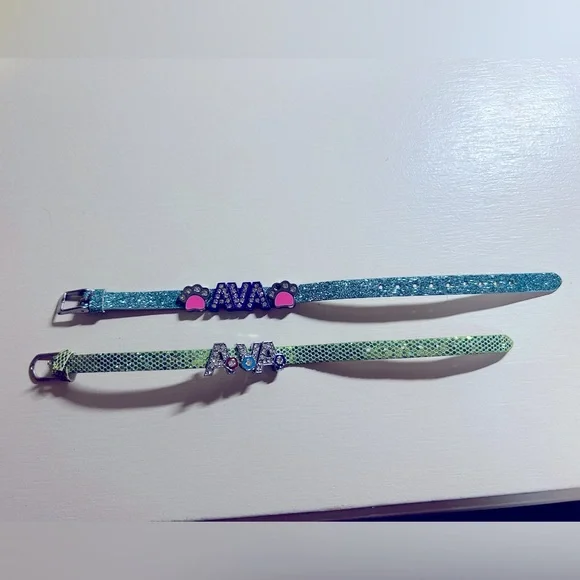 Two girls super cute glitter brackets with name Ava. Gently used