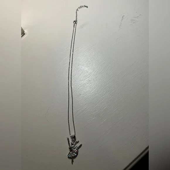 Girls 16” silver necklace with 2” extender. Has a ballerina pendant with stones.
