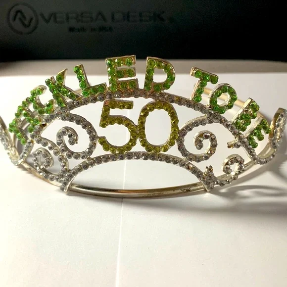 Rhinestone “Tickled to be 50” tiara. Measures 5 3/4” widest part of headband.