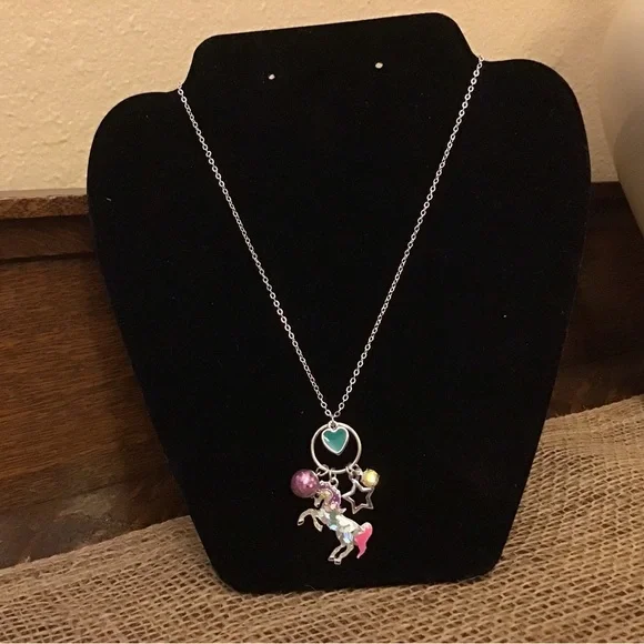NWT Justice necklace. Unicorn, heart, glitter ball, star and rhinestone charms.