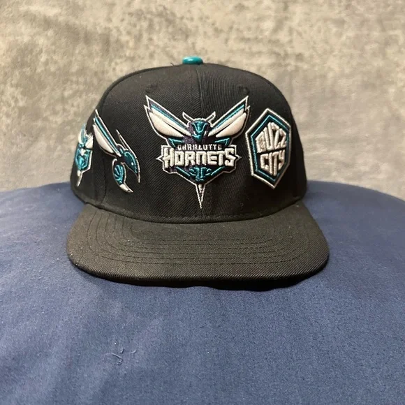 PRO Brand Charlotte Hornets Multi-Logo SnapBack Hat.