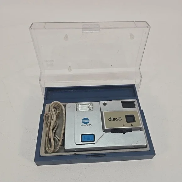 Minolta Disc‎ 5 Disc Film Camera, silver, with Case