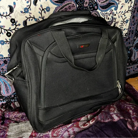 Delsey rolling carry on luggage bag