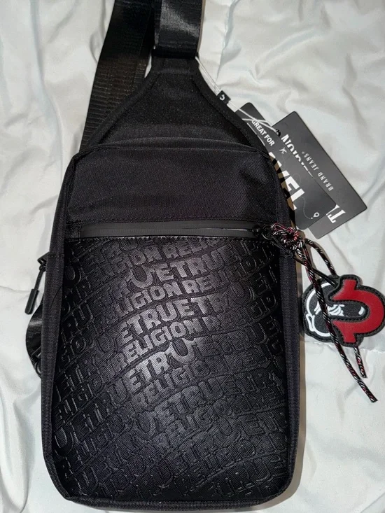True Religion Black Embossed Logo Sling Bag with Red Accent Charm