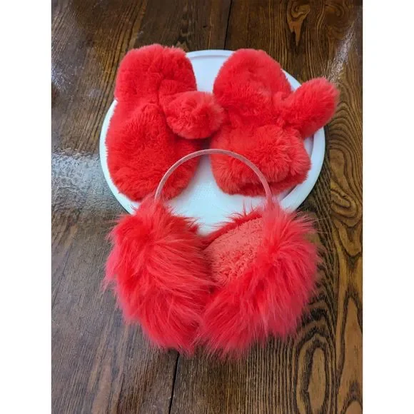 Girls red fluffy mittens and earmuffs