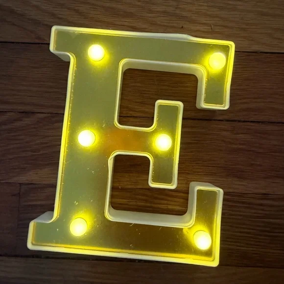 Illuminated Yellow Letter 'E' Marquee Light