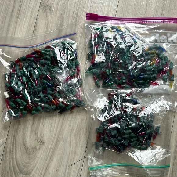 Bags of mini holiday Christmas mini light bulbs. Different brands.