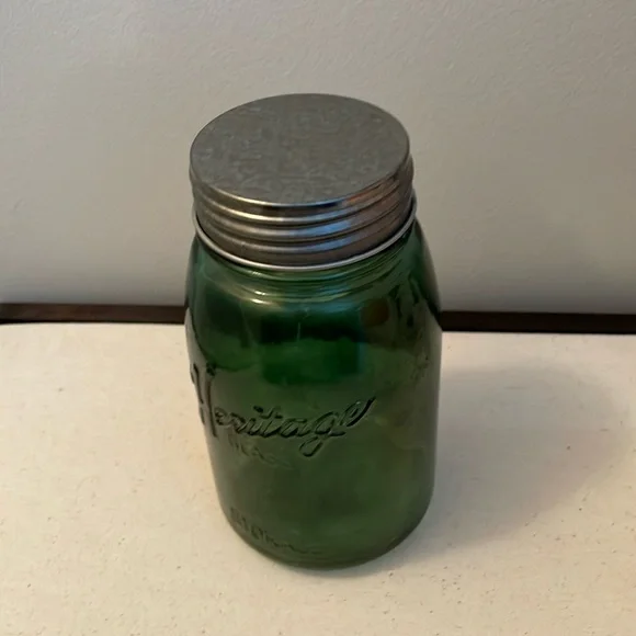 Green Decorative Jar with Lights on inside .