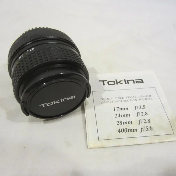 TOKINA 28mm 1:2.8 lens w/ Spectrum 7 49mm Skylight 1A filter