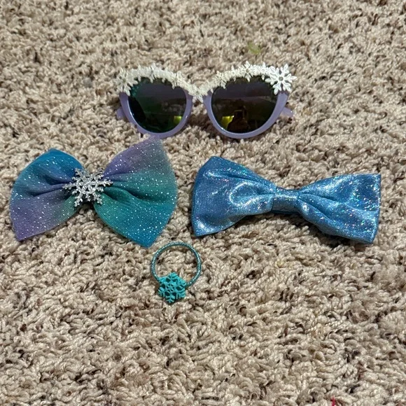 Girls Elsa hair accessories and snowflake rimmed sunglasses