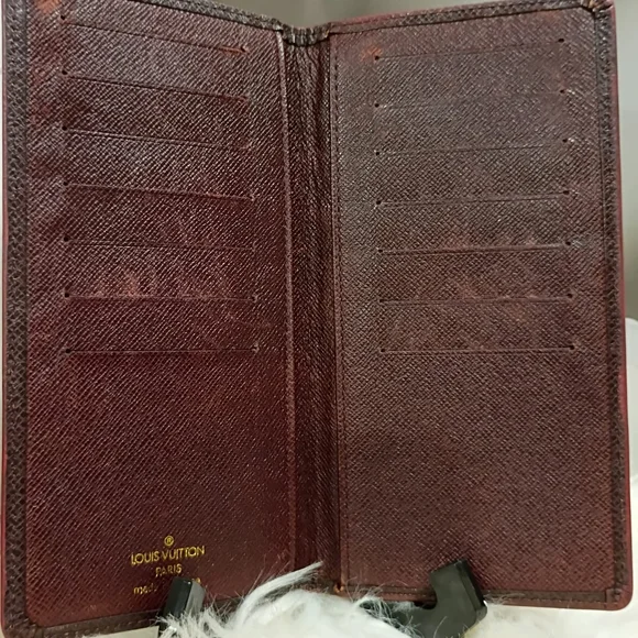 Louis Vuitton Taiga leather long wallet.