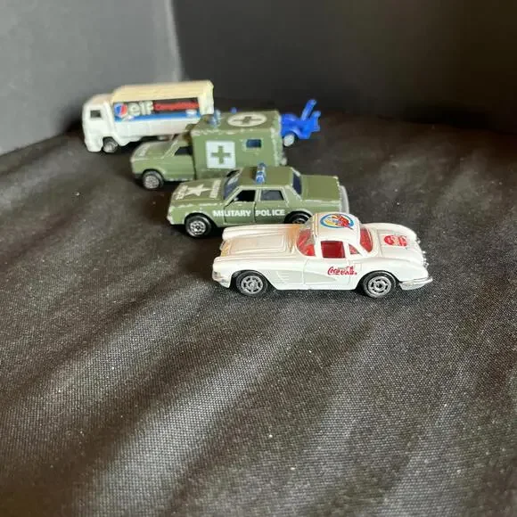 Vtg. Majorette Lot Of 4, ELF Truck, AMBULANCE, MILITARY POLICE & Coke Corvette