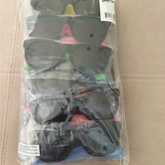 Twelve Plastic Sunglasses