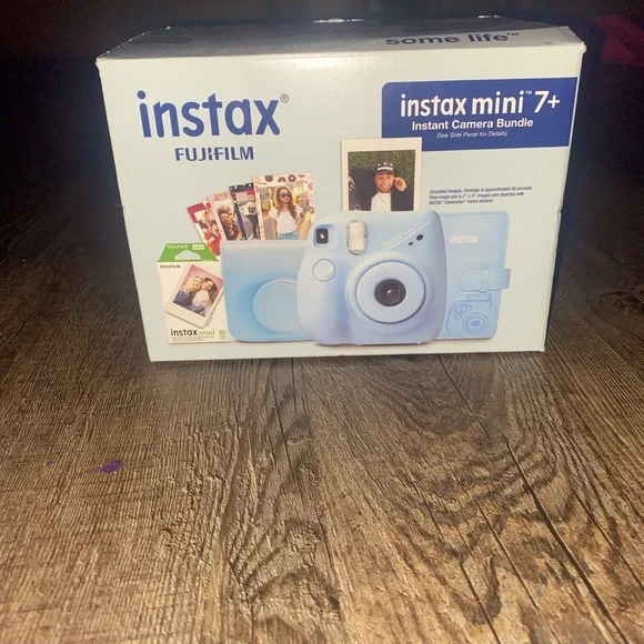 Baby Blue Polaroid Camera with photo book, film, and etc.