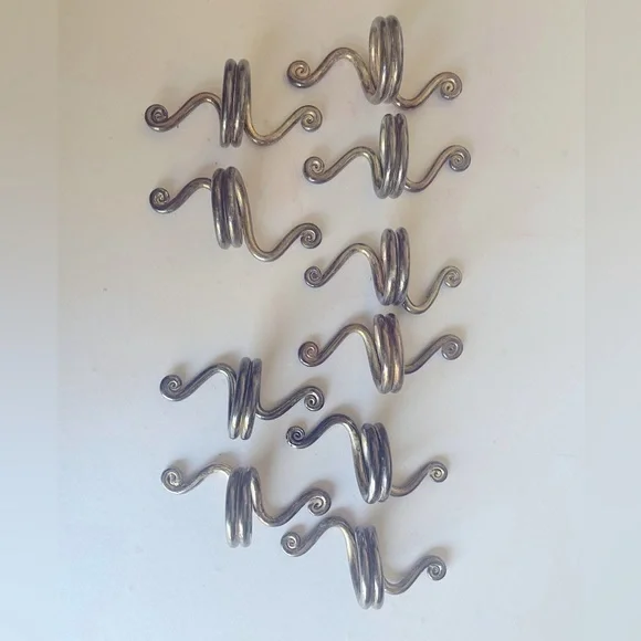 Set of 10 silver plated napkin rings.