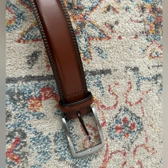 Beautiful brown belt with silver buckle. New, never worn.