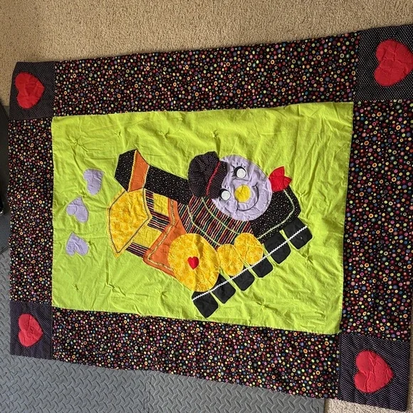Playful Train-Themed Quilt with Vibrant Accents