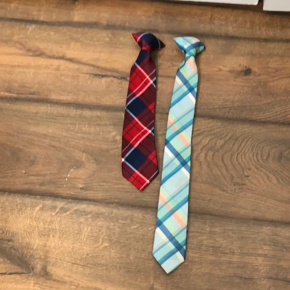 Two toddler ties, one turquoise & blue plaid and the other red & blue plaid