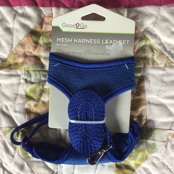 Dark blue mesh cat harness with leash.