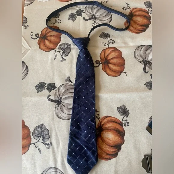 Kids 100% silk Nautica navy tie.