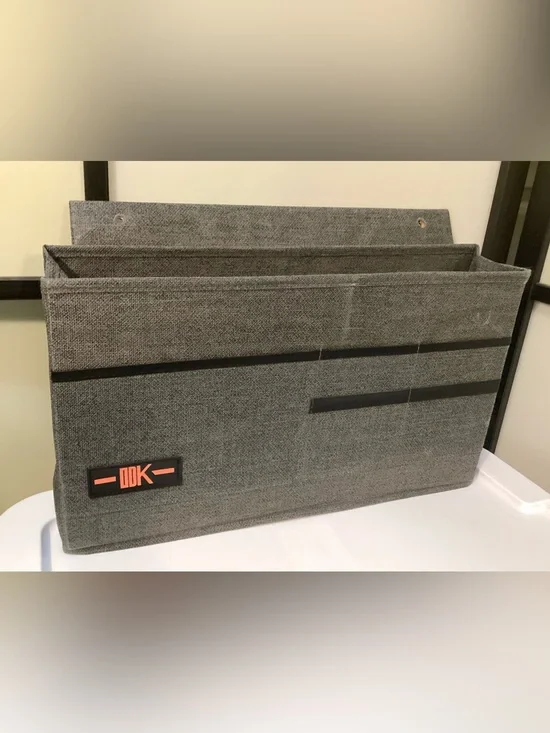 Desk side hanging organizer storage bag with 3 pockets.