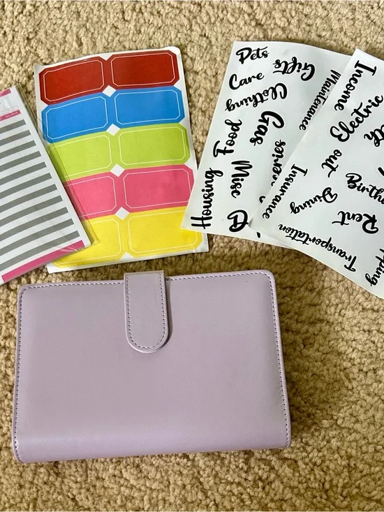 Lilac color budget binder with magnetic closure.