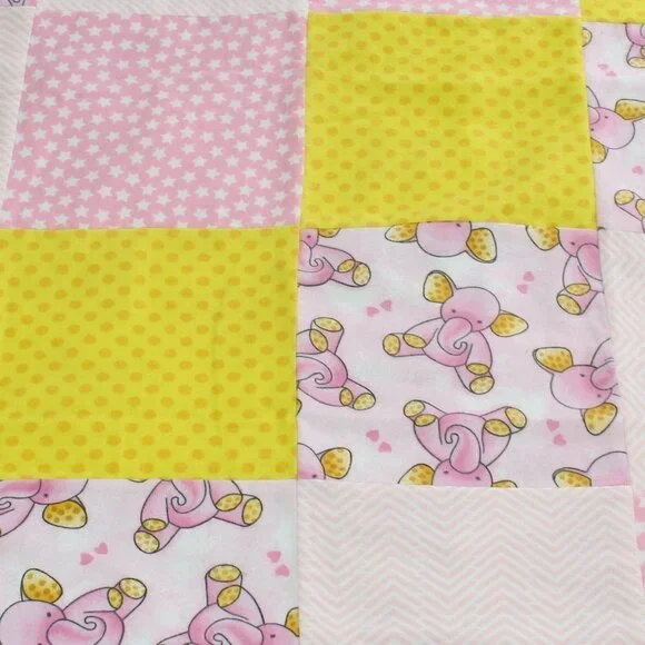 Homemade pink baby elephant zig zag strars yellow dots receiving blanket.