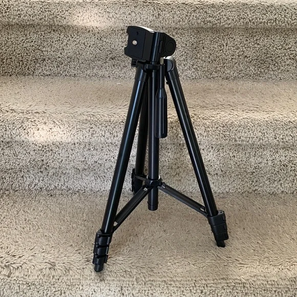 Tripod stand only. Black, adjustable.