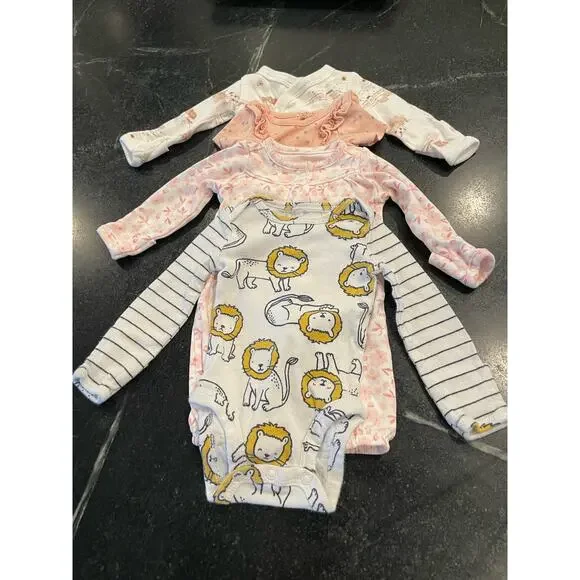 Carter’s Bundle of 4 (four) Preemie / newborn onesies.