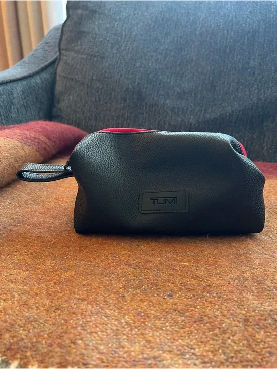 Tumi El Al Business Class Amenity Kit, featuring a black pebbled exterior