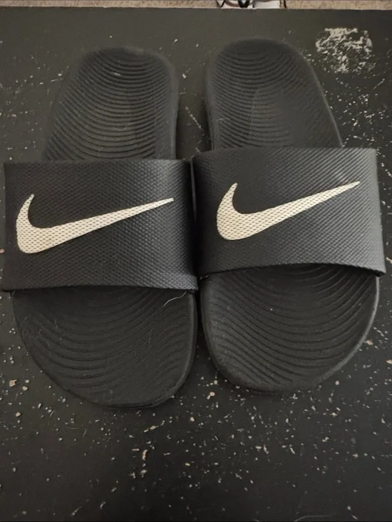 Nike Black Slides with White Swoosh Logos